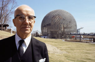 Buckminster FULLER before his geode dome at Montreal World Fair.