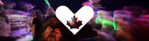 The Canadian "Giving Tuesday" logo of a heart with a maple leaf in the middle, displayed on a motion-blurred background of people at a club.