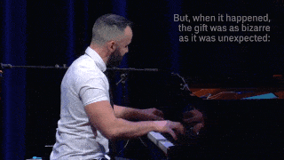 A person with short hair and beard, wearing a white polo shirt, plays at piano. Caption reads “But, when it happened, the gift was as bizarre as it was unexpected”.